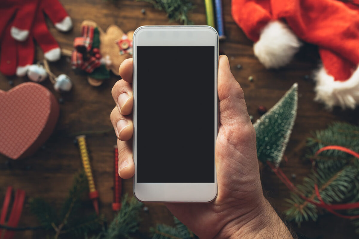 A woman holding a smartphone for decorative purposes